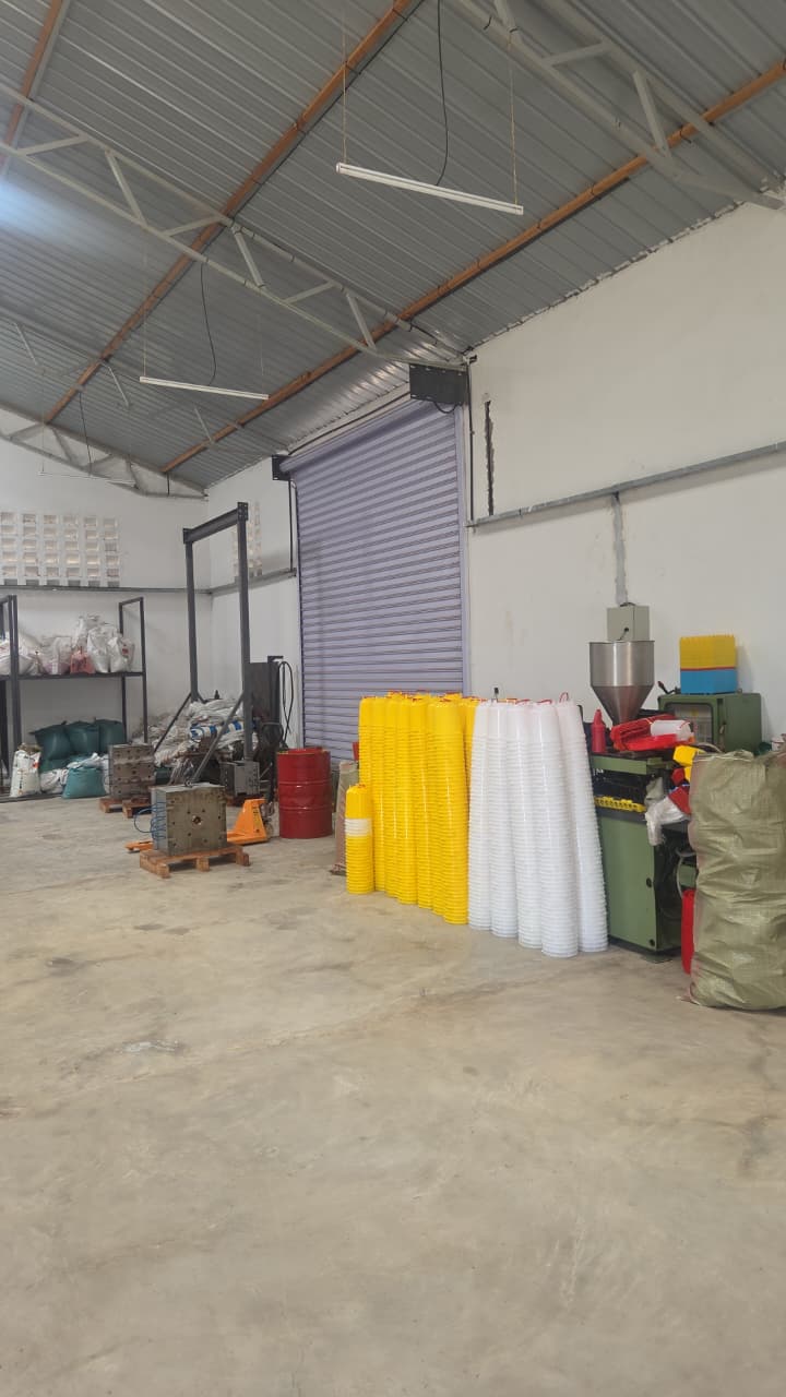 Fuga factory floor with moulds, pallet jack and finished product stacks