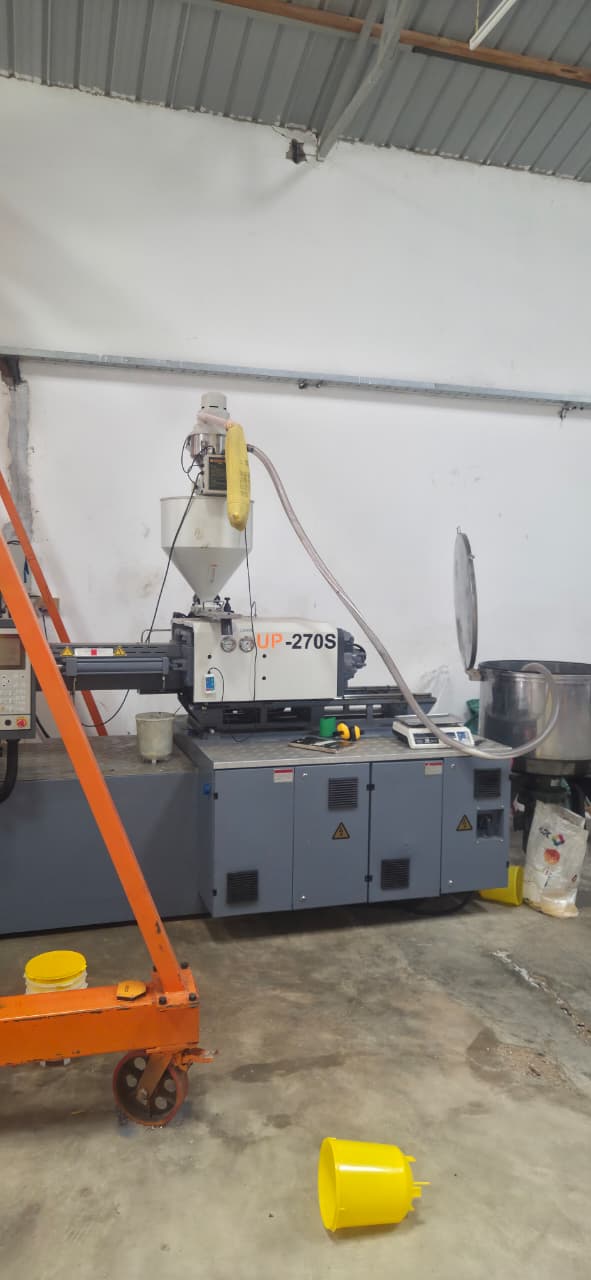Injection moulding machine running on the Fuga production floor