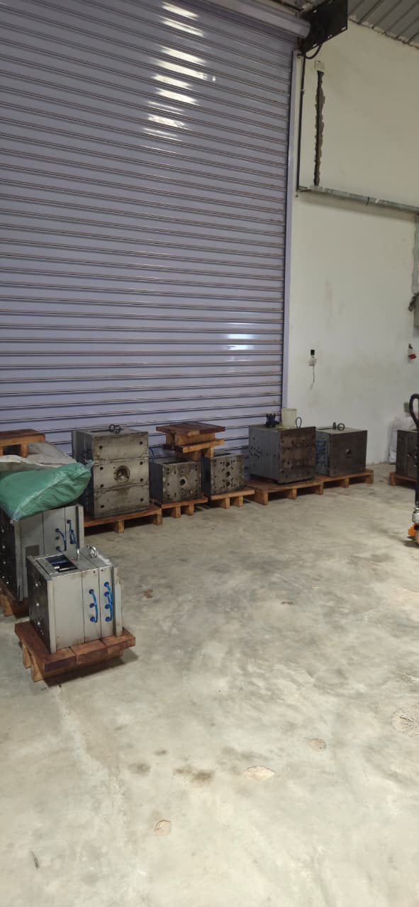 Row of steel injection moulds on pallets in the Fuga tooling store