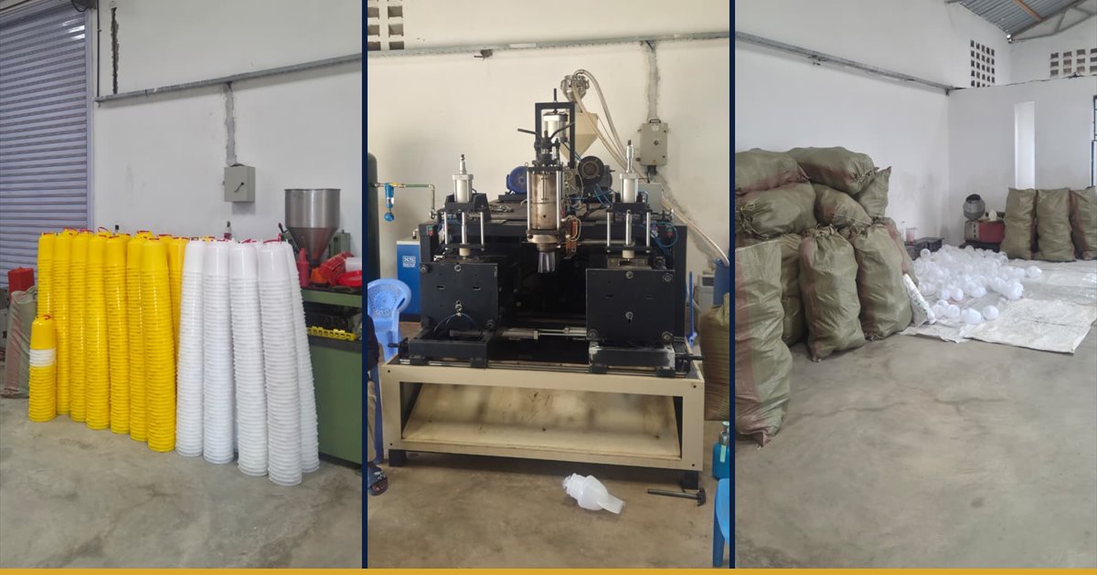 Inside the Fuga plant: moulded poultry feeder cones stacked beside the blow moulding machine and the raw material store